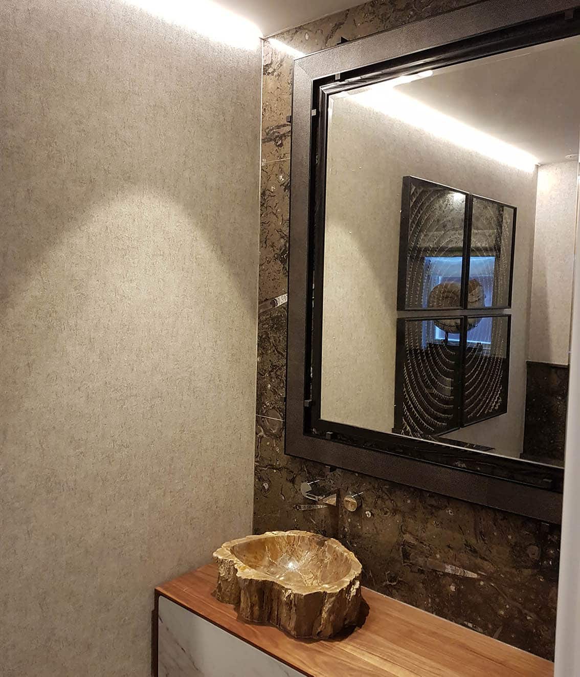 Tektura wallpaper installation in a stylish bathroom.