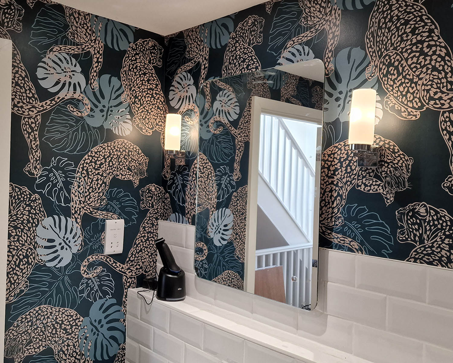Leopard Art Deco wallpaper installation in bathroom.