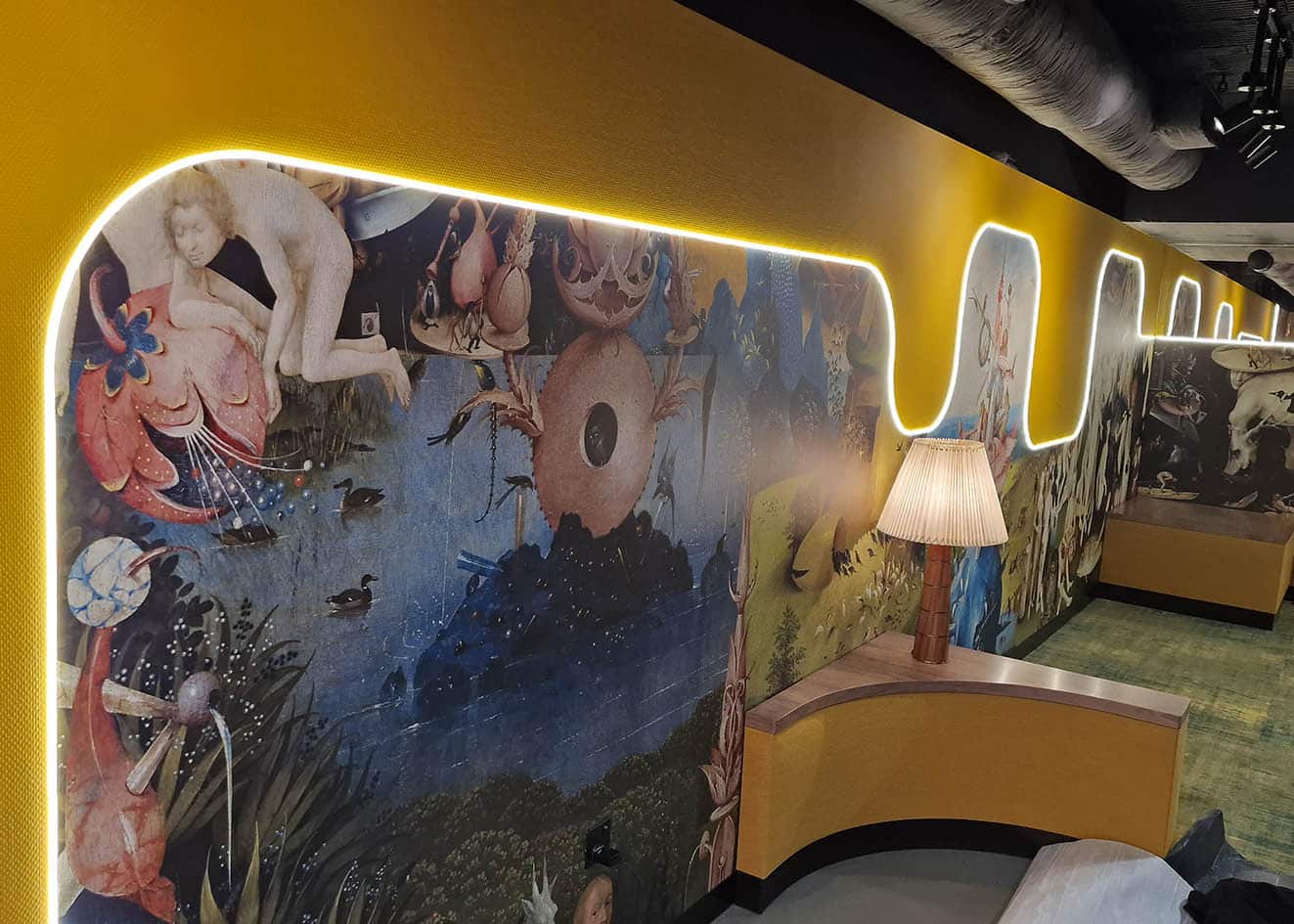 Made to measure wall mural installation by Bluespec Decorating Limited wallpaper hangers in a club in London. The mural is called “The Garden of Earthly Delights”. It is on curved part of a wall. The original painting is representing gate of heaven and hell.