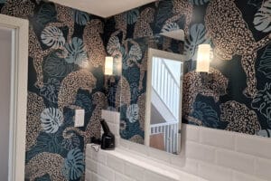 Wallpaper in bathroom - tigers ,Milton and King brand. in blue and orange.