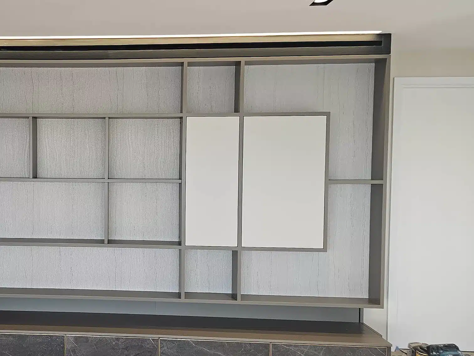 Wallpapered shelves professional installation..
