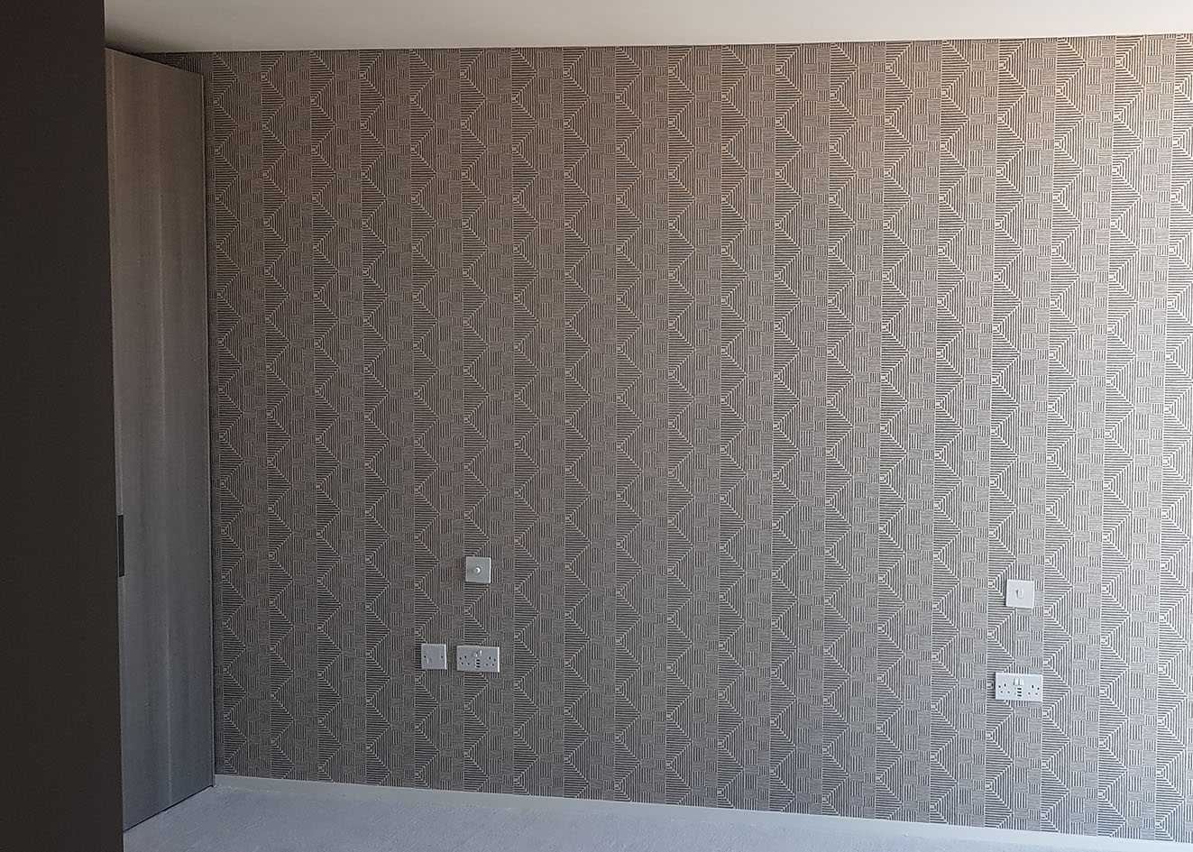 Featured wall wallpaper installed by wallpaper hangers specialists.