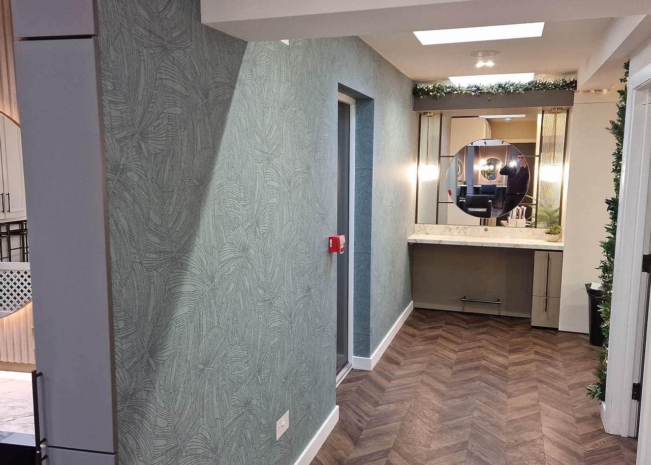 luxury high-end wallpaper leaves, blue colour hanging in a hairdressing salon.