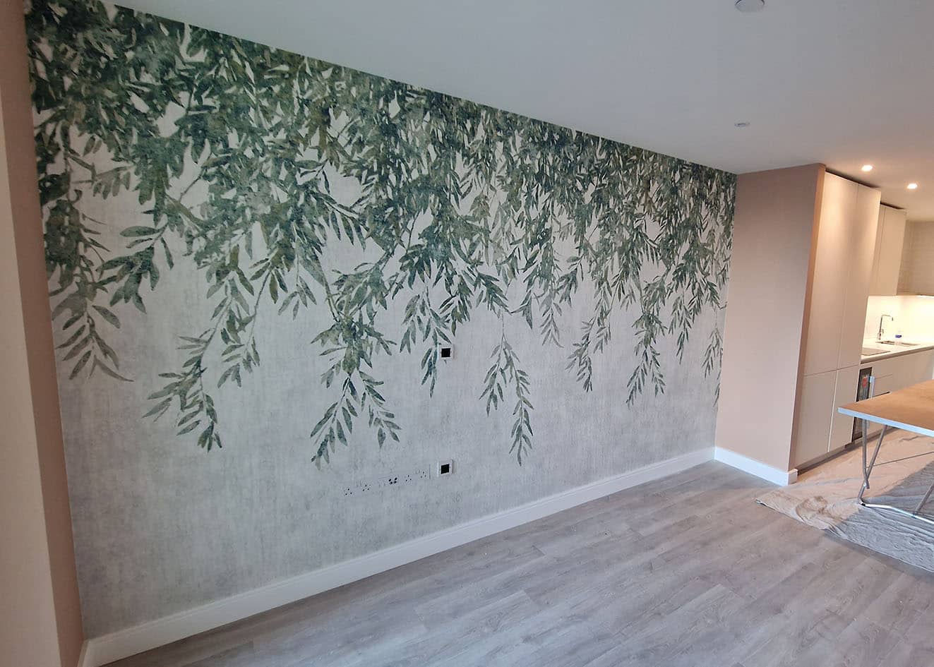 Feature wall botanical wallpaper installed by specialists wallpaper installers, London.