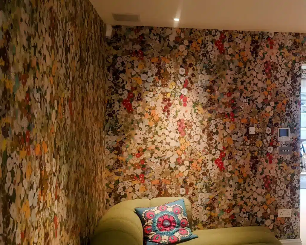 Floral designer wallpaper installed in a London living room.