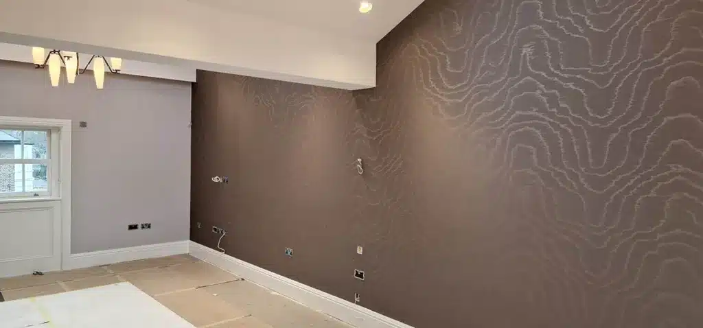 Stylish wallpaper professionally installed in a living room, London.