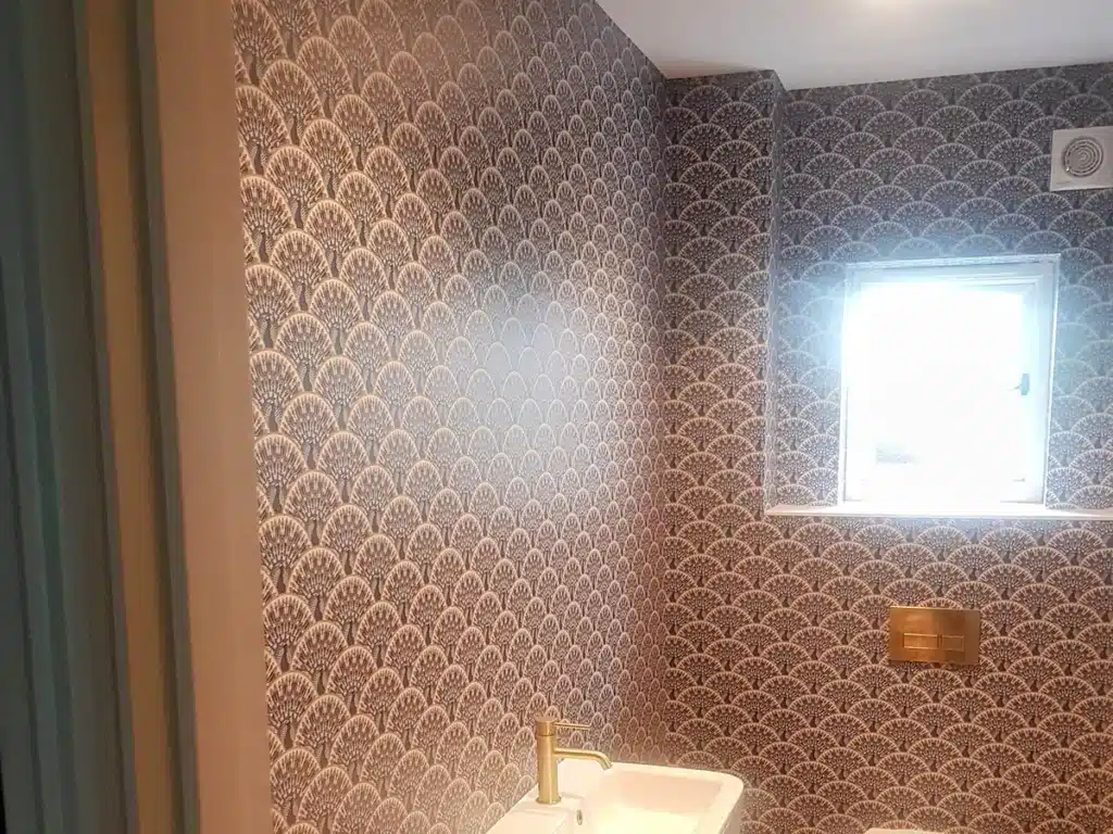Wallpaper installation in a bathroom.