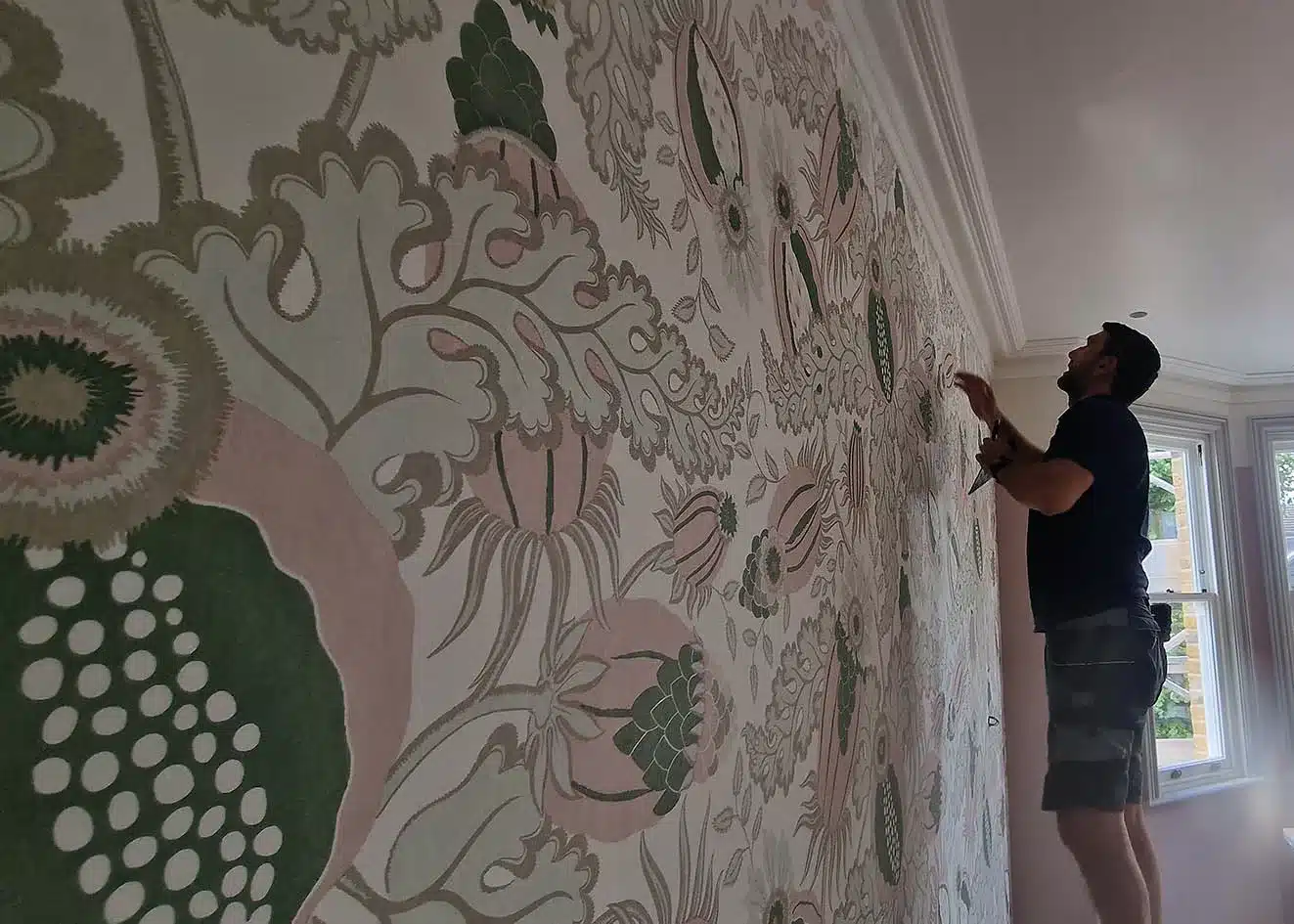 Transform bedroom with the right wallpaper. Wallpaper installer installing wallpaper.