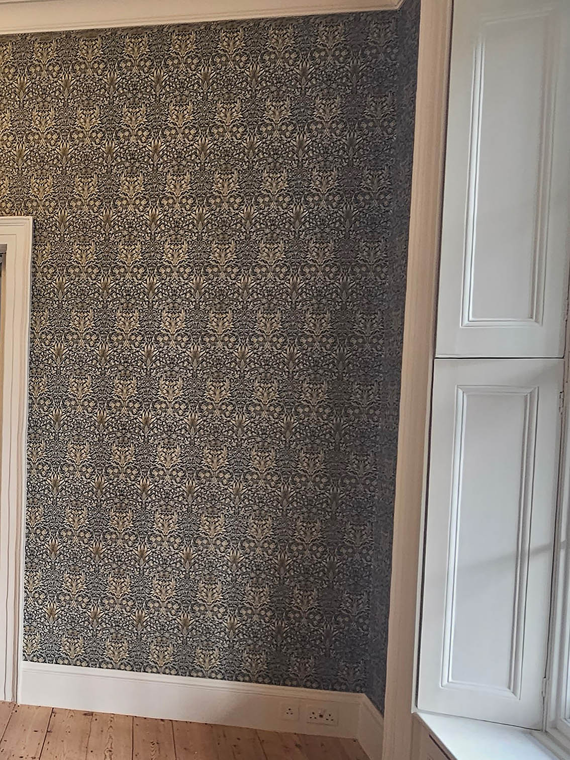 Vintage wallpaper installed by a professional wallpaper hangers.