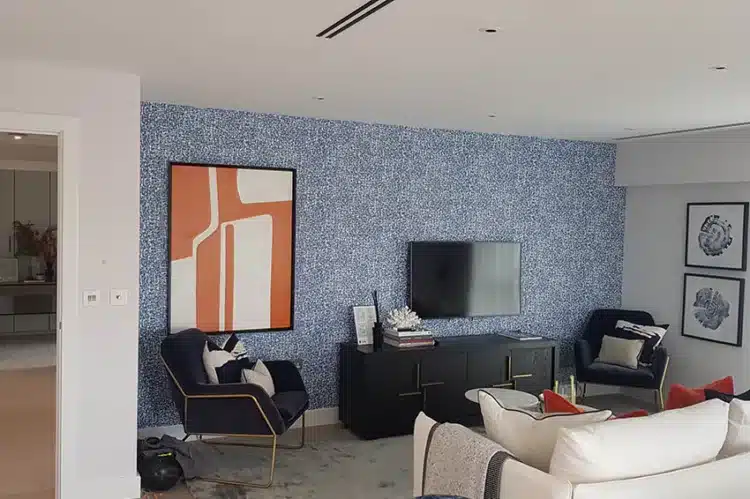 Living room wallpaper installation project.