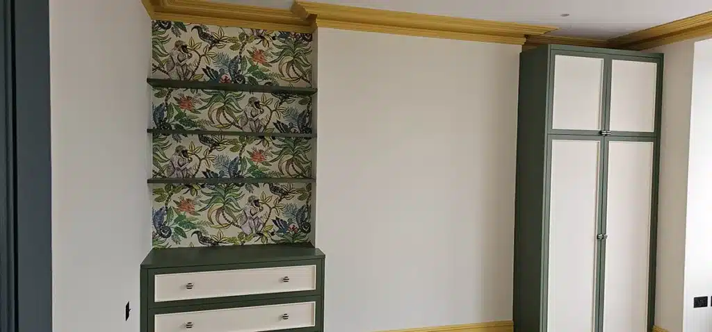 Wallpaper lined shelves, professionally installed by Bluespec Decorating Limited wallpaper hangers.