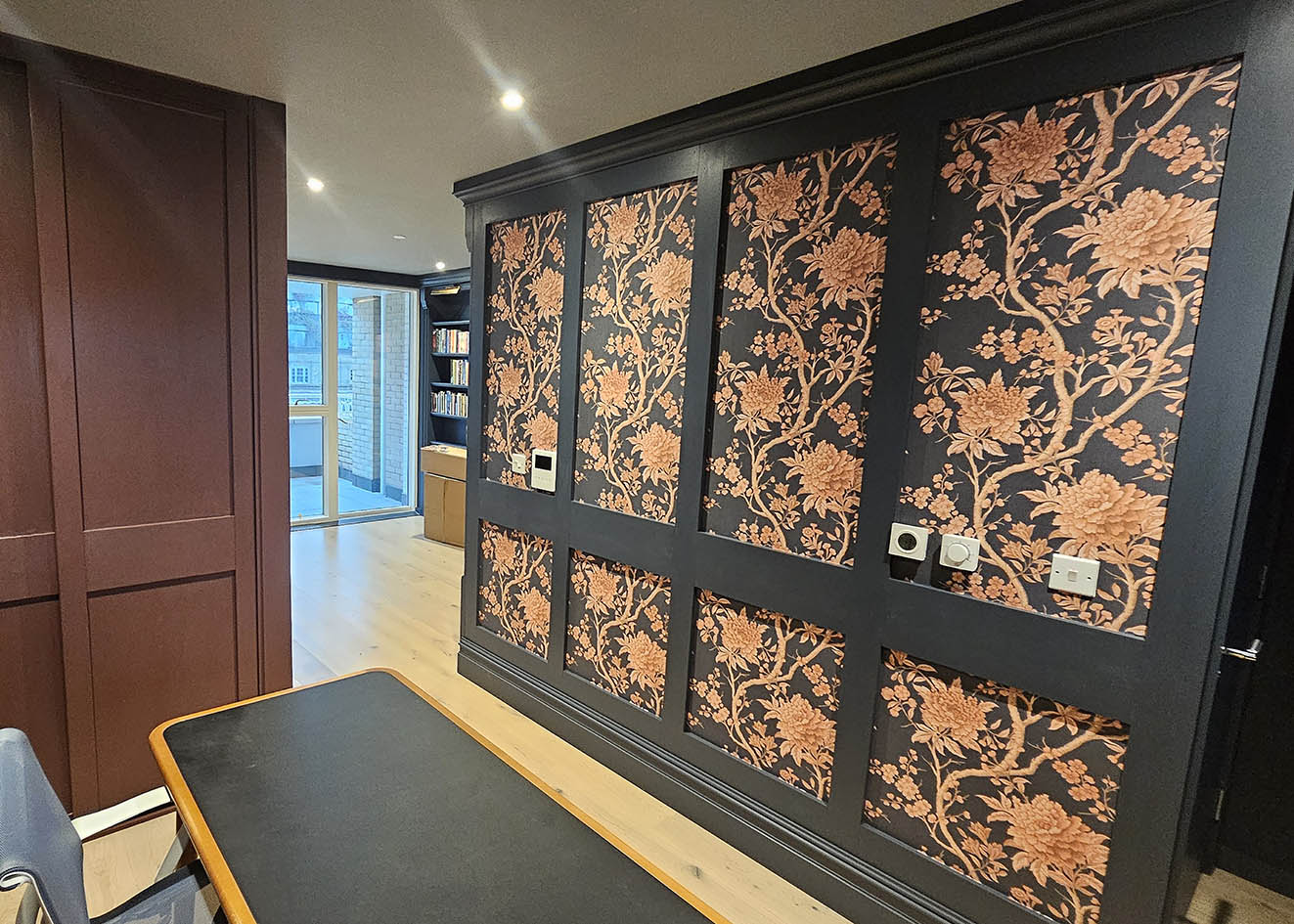 Porcelain Trail Chinese style wallpaper installed in dark grey frames.
