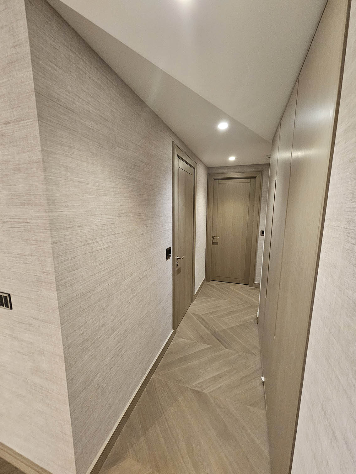Professional wallpaper hangers install Arte textured wallpaper hallway Swiss Cottage London flat