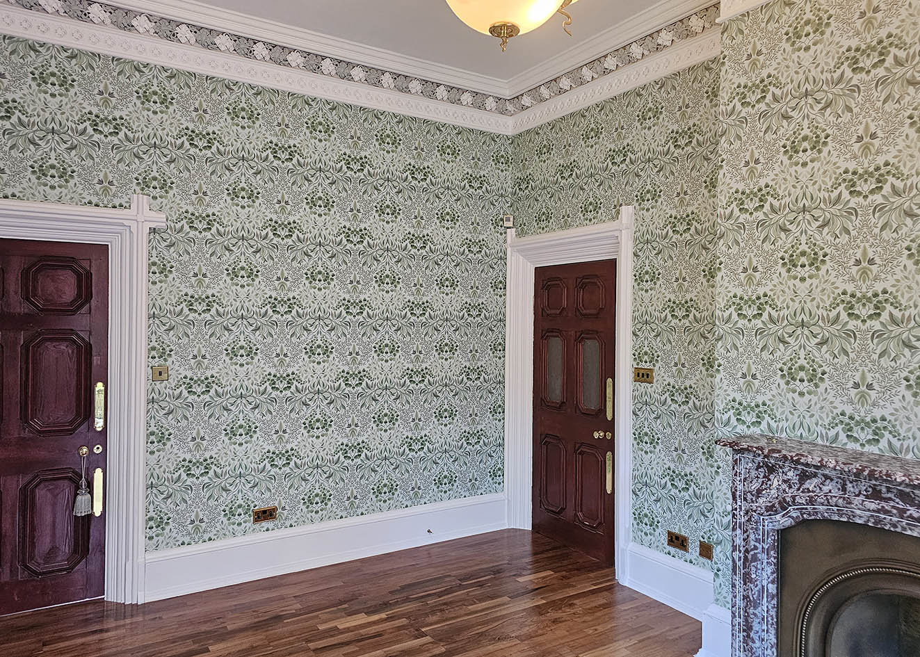 wallpaper-hangers-gerrard-cross-London Wallpaper hanging by Bluespec wallpaper hangers in white and green in heritage property.