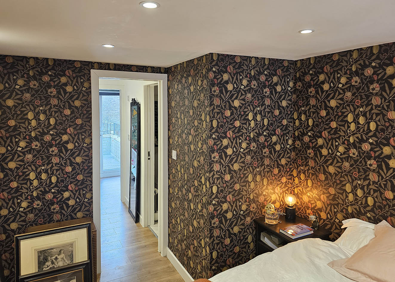 brown-and-gold-wallpaper-hanging-Barnes-London Dark wallpaper with golden coloured fruit professional wallpaper installation in Barnes, London by Bluespec Decorating Limited.