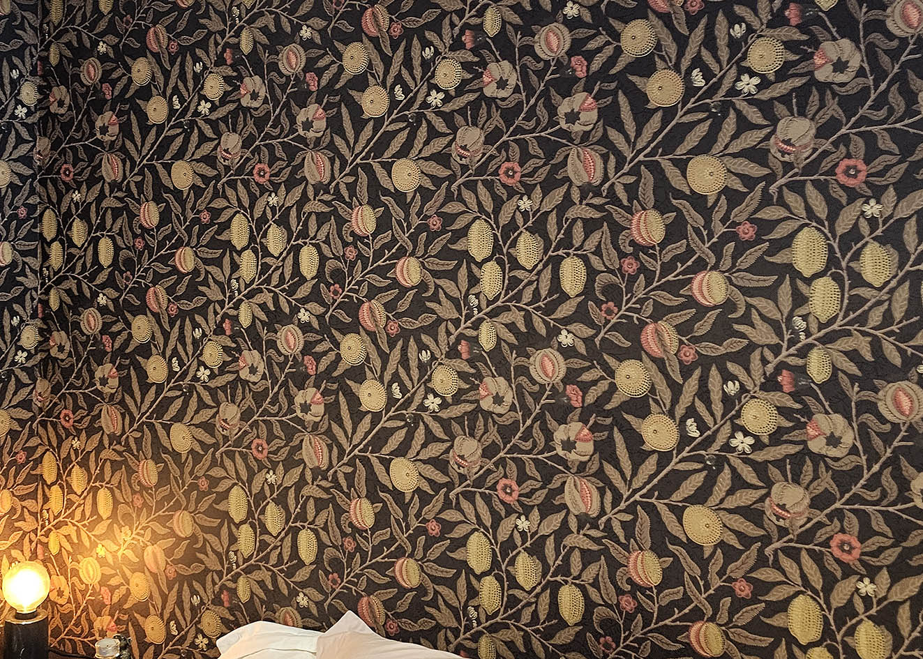 pomegranate-william-morris-wallpaper-ihanging Close up of pomegranate, fruits and leaves wallpaper expert wallpaper installation.