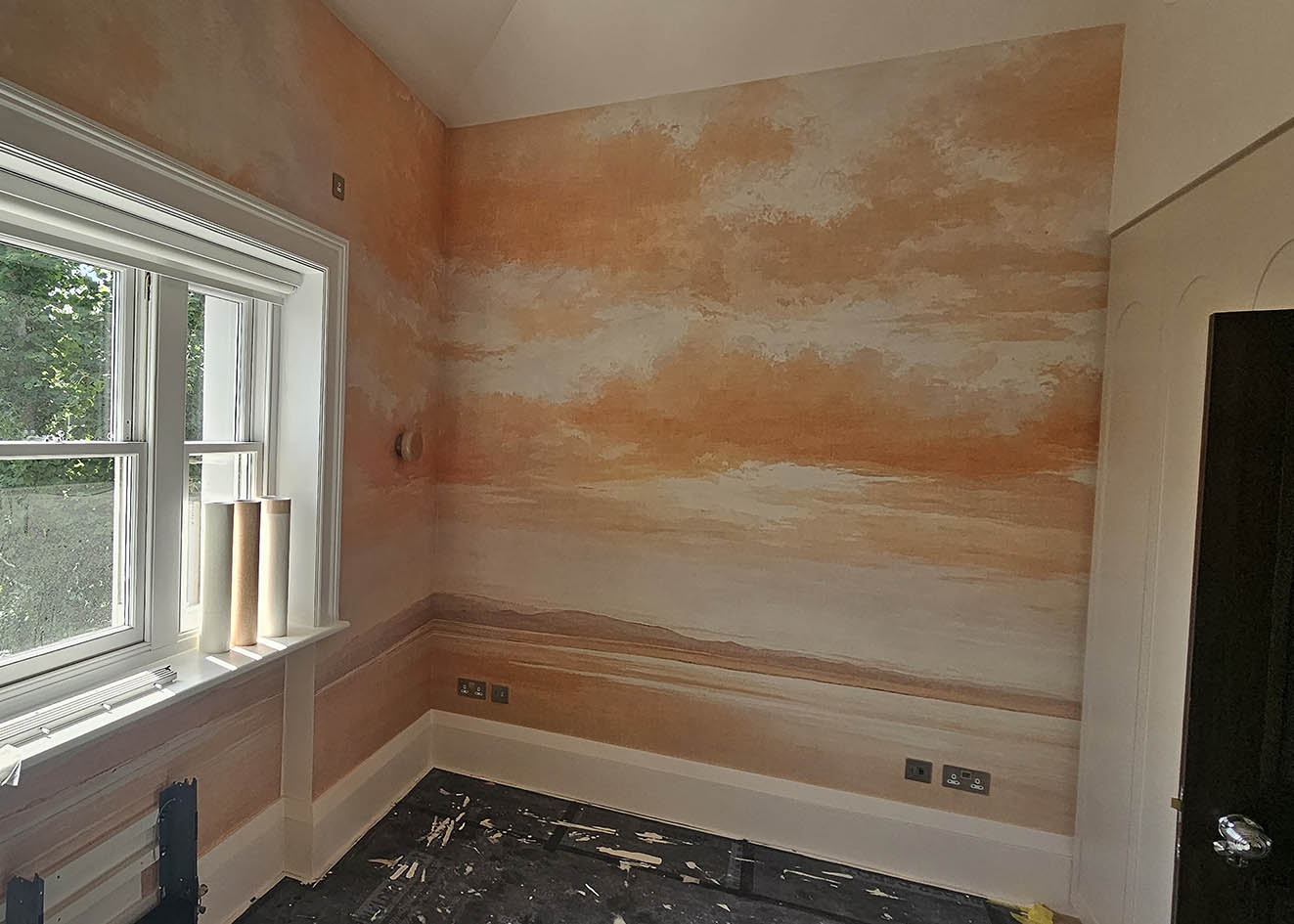 wallpaper-staircase-landing-installed-Belgravia Wallpaper mural hanging on a staircase landing in Belgravia.
